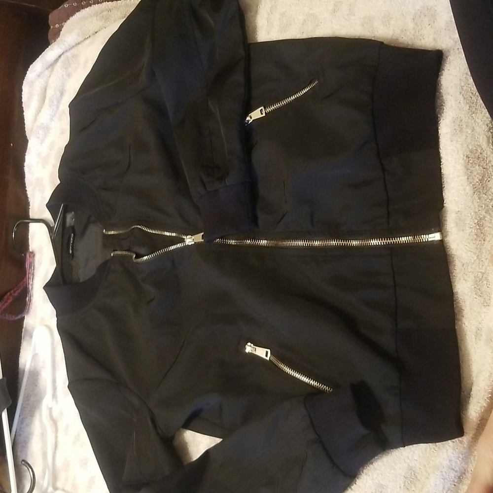 Black jacket with gold zippers